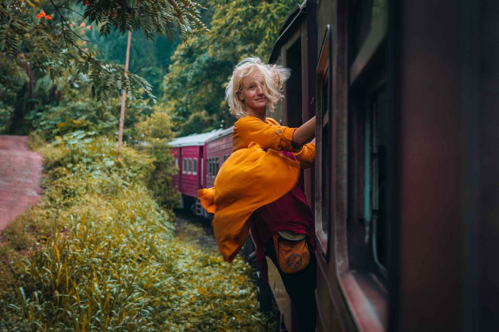 Female leaning out of train